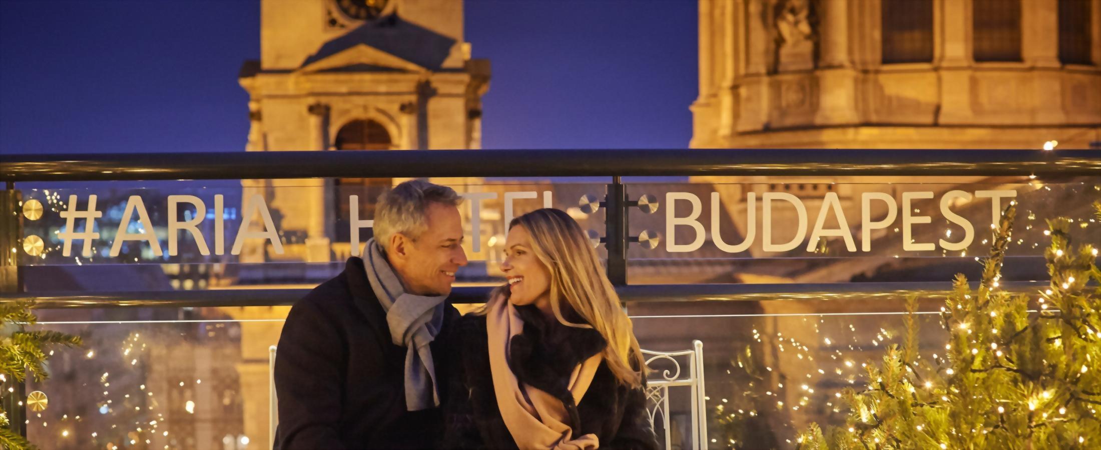 Couple on rooftop during the winter season.